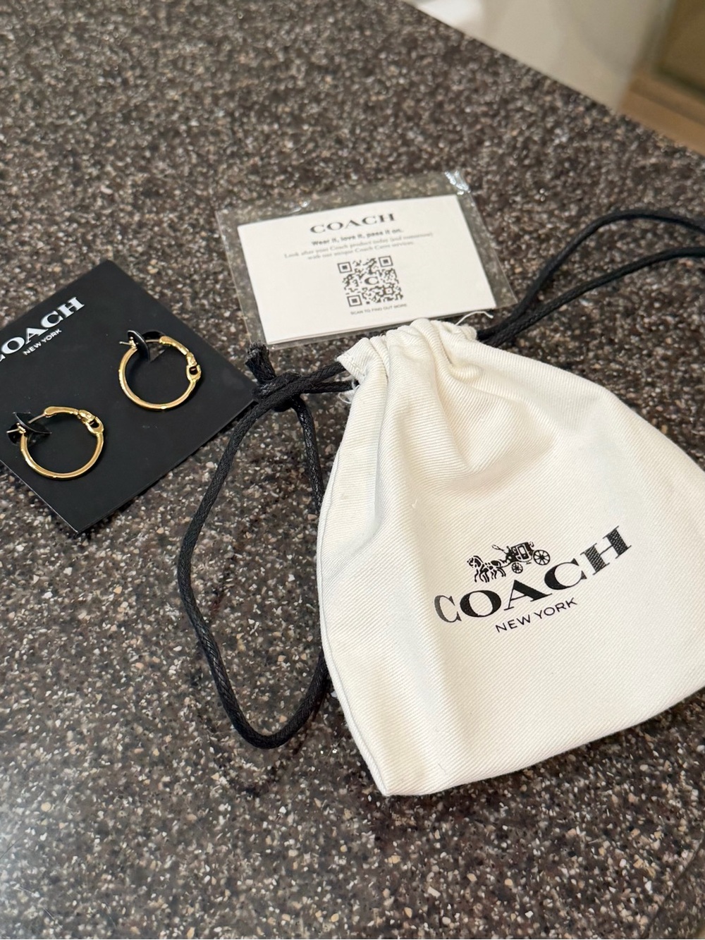 COACH White Drawstring Pouch with Gold Hoop Earrings